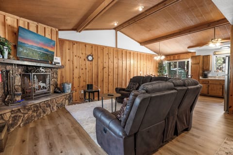 Living room with large sectional and television. 