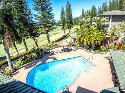 With the fairway in view and tropical blooms all around, the pool becomes more than a place to cool off—it’s your island sanctuary    