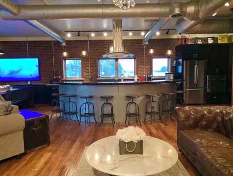 Beautiful curved bar overlooking the pool and airport property.