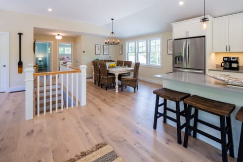 Open living and dining on the main level - stairs down to lower level