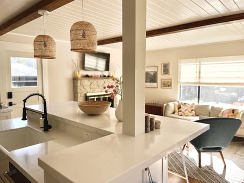 Easy mingling between kitchen and living room.