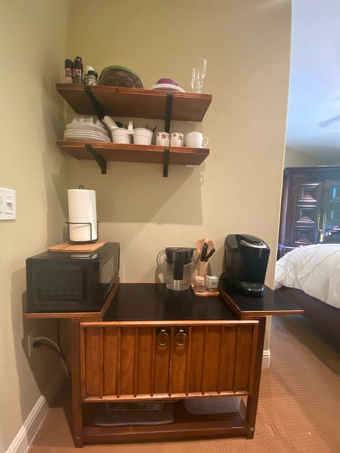 Kitchenette area has microwave and a Keurig