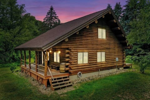 A modern, warm, and inviting log cabin with rustic aesthetics and farmhouse influences.