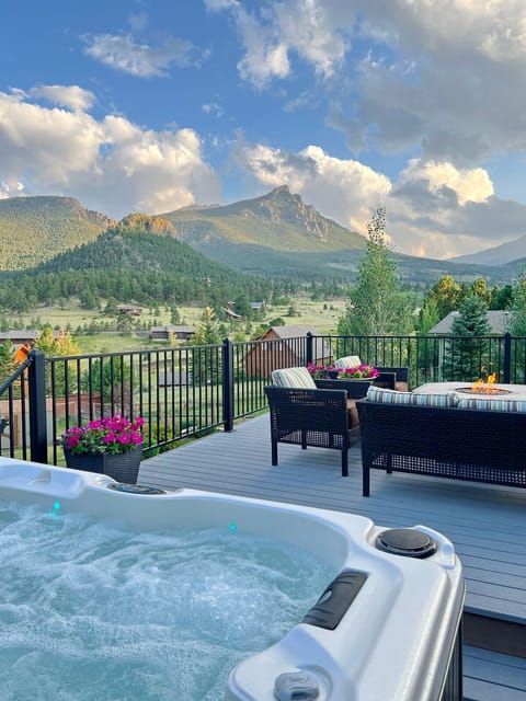 Back deck with amazing views, seating, gas fire pit table, hot tub and grill