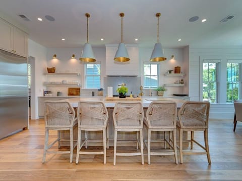 Kitchen with large island/counter barstools