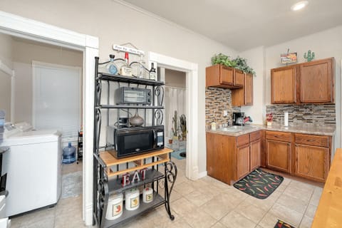 Kitchen with Microwave and Toaster Oven. Free Laundry Room on the Left