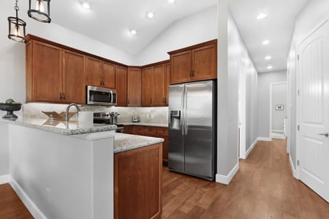 Off of the kitchen is the hallway to access the homes bedrooms