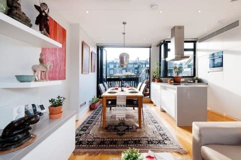 Dining area, opening onto terrace through bi-fold doors and with rooftop views