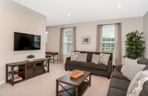 Watch your favorite movies in comfort with a cozy seating area and a smart TV. Whether it’s a movie night or binge-watching a show, the living room is set up for relaxing entertainment.