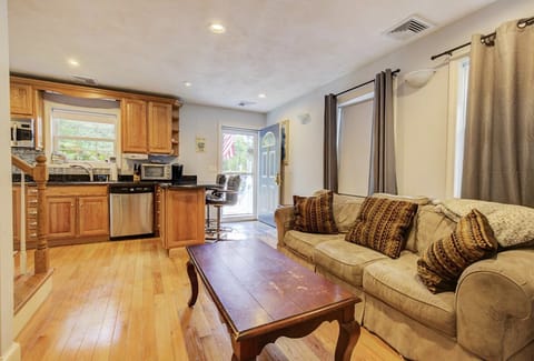 Living room with 6’ couch 
65” hd tv with Apple TV Eat in kitchen 2 barstools 