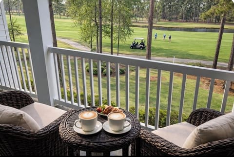 Morning coffee with golf course views—your private balcony overlooking the green