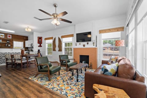 Living room and kitchen open room concept adjacent to the dining area and kitchen of the main house.