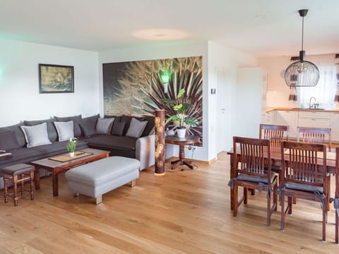 Table, Couch, Furniture, Property, Picture Frame, Interior Design, Wood, Lighting, Comfort, Houseplant