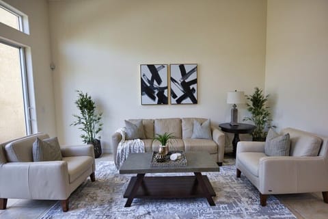 Modern living room with leather seating and abstract wall art
