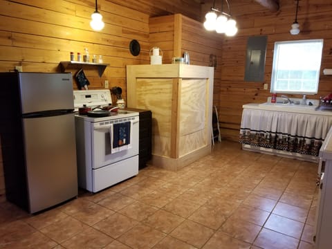 Kitchen with Fridge Microwave and Stove