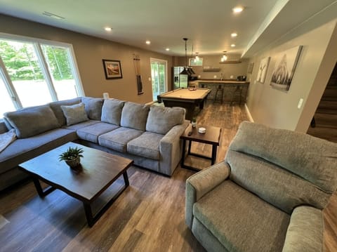 Newly finished basement with bar and pool table 