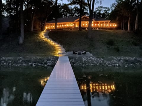 View from rear of house from pier at night