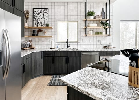 Sleek, chic, and ready to impress: Unleash your culinary creativity in our kitchen, adorned with beautiful melamine cabinetry and luxe leathered granite.