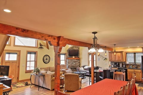 3 couches & ottoman, 1 chair w/ ottoman, recliner, & a large slate coffee table