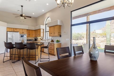 dining room looking into the kitchen and backyard