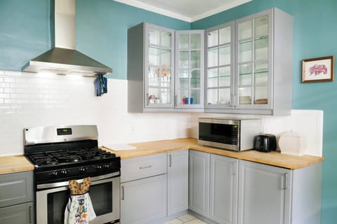 Stainless, butcher block, and soft close cabinets