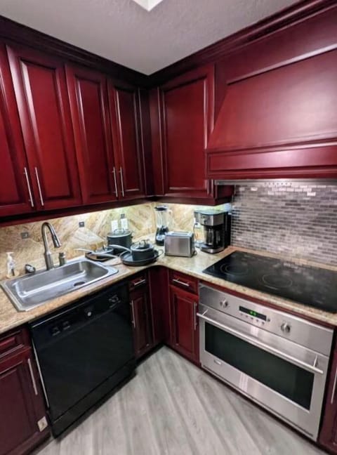 Full sized kitchen with pots/pans, cutlery, toaster, coffee maker, blender
