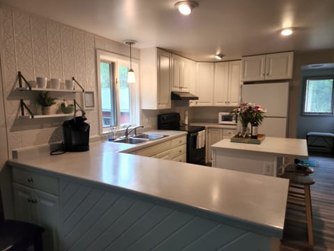 The Kitchen is fully supplied with everything needed to make meals at home.