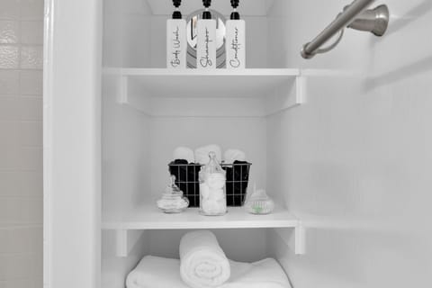 Toiletries provided. Shampoo, conditioner, body wash, and plenty of white fluffy towels.