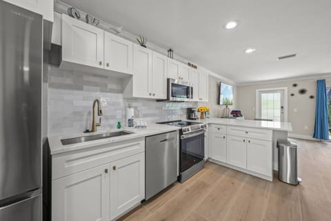 Sleek, modern, and open — the kitchen of your dreams is ready for culinary adventures.