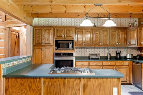 Plenty of kitchen utensils, microwave, conventional oven, small appliances.