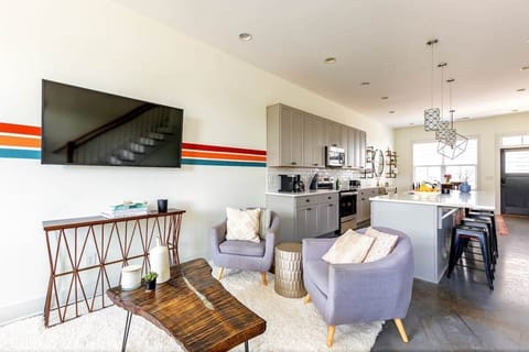 The wall-mounted smart television lets you easily connect to all your favorite streaming apps.