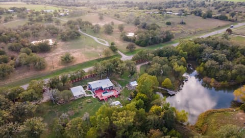 An aerial view of the home and amenities located on 3 acres. 