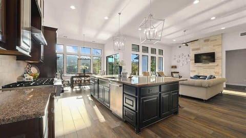 The spacious kitchen is open to the living and dining areas.