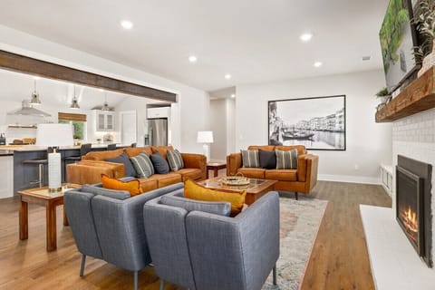In the living room you'll find a leather couch, a leather loveseat and two lounge chairs. Settle in for a movie on our 65-inch Samsung Smart TV or curl up with a book in front of our working gas fireplace!