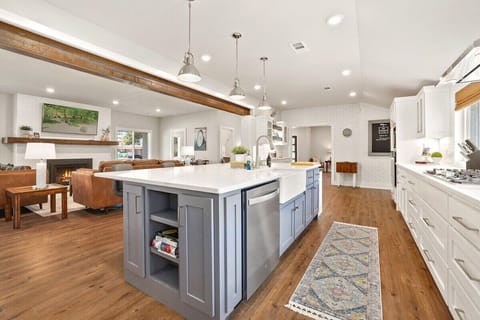 Behind the living room, you'll see our large, fully stocked kitchen.