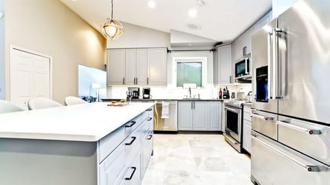 Stainless steel appliances, dishes, glasses, pots, pans, knives and everything you’ll ever need: oven, toaster, Keurig coffee maker, blender, and microwave.