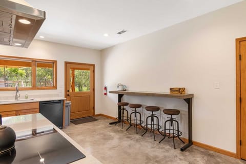 Bar-style seating near the dining area provides even more room for conversation and laughter around mealtimes!