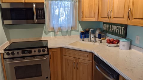 Kitchen- stove, dishwasher, fridge and microwave.