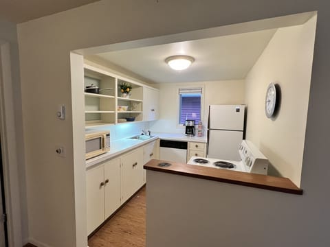 A sweet kitchen that is cleaned and sanitized after each stay. 