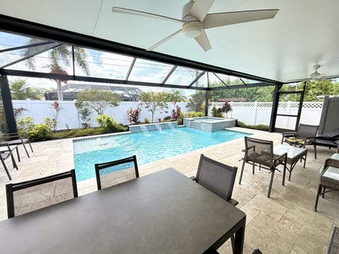 Spacious, covered, screened lanai overlooking beautiful heated pool and spa.