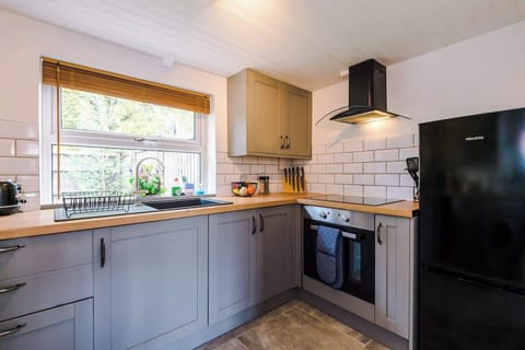 The kitchen has all the necessities you need for a short or long-term stay in Little Stanney.