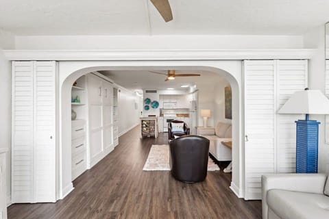 View from enclosed lanai back into primary living space and kitchen