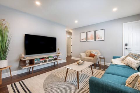 Lower Living room with door to get to the upstairs indoors. 