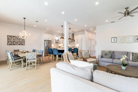 Living room is near the dining area and kitchen.