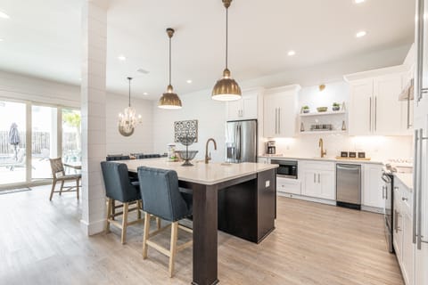 Spacious kitchen with barstool seating.