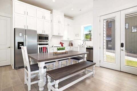 In the kitchen, you'll have access to amenities such as a Keurig, high-end appliances and plenty of built-in storage. You'll also have access to a large glass door leading out to the side of the house.
