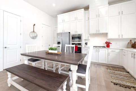 Directly behind the living room, you'll see our 6-top dining table.