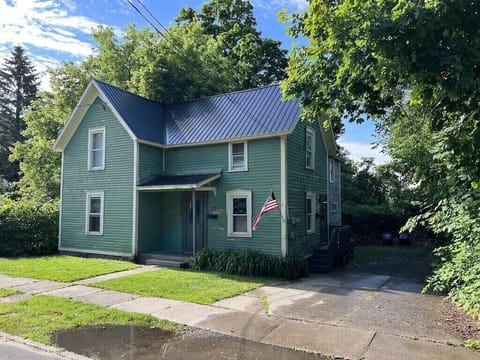 Covered front door is main entrance to the apartment. 