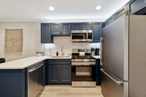 Updated well stocked kitchen with stainless steel appliances