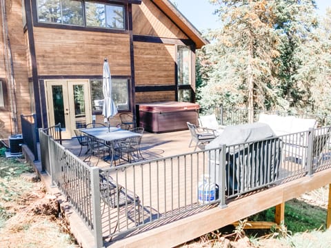 Our back deck is a nice hideaway with plenty of seating and a hot tub.